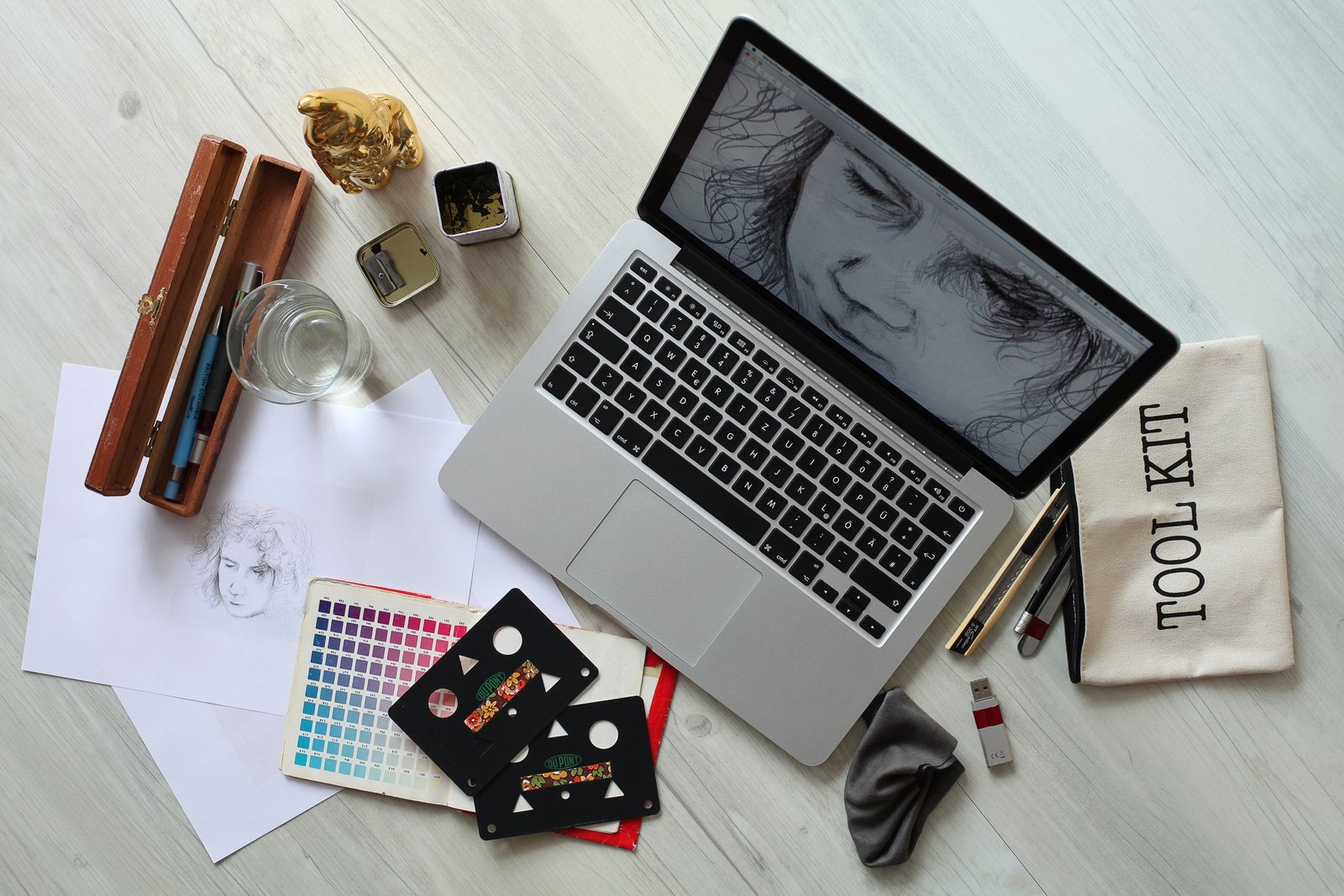 Creative workspace with a laptop and design tools